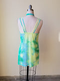 tie dye mesh minidress and choker on a dressform for rave clothing